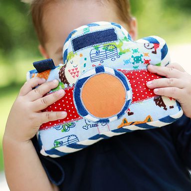 Little Photographer Camera - Swoodson Says. A softie perfect for imaginative play, including a vinyl pocket in the back to insert real photos.