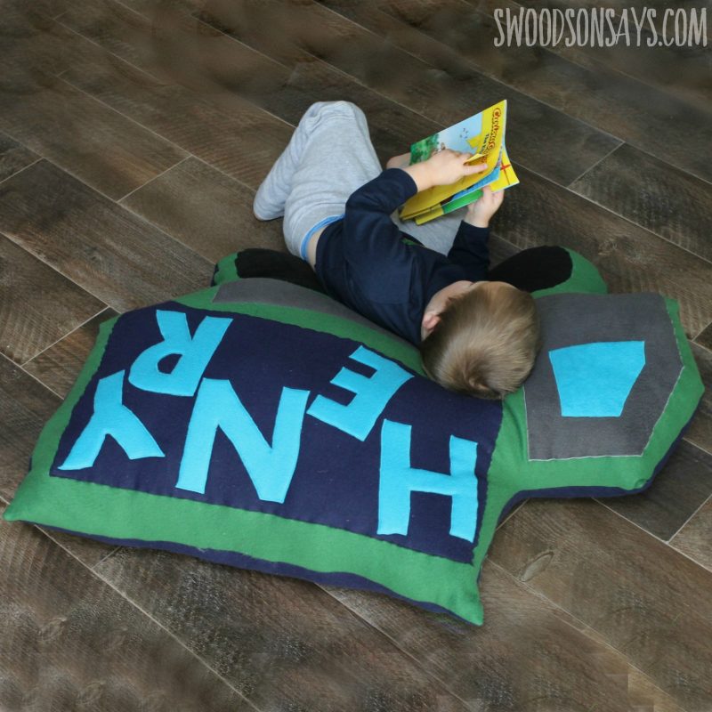 Free mega dump truck pillow sewing pattern! Grab some cheap fleece and sew up a comfy spot for kids to curl up and read. Perfect gift to sew for boys and girls, and to use up all your fabric scraps as stuffing! Swoodsonsays.com